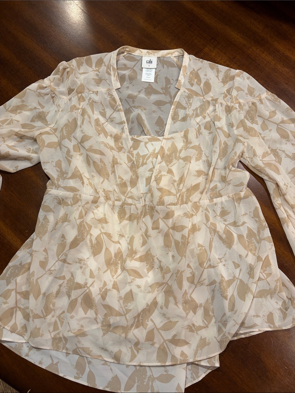 cAbi Cream and Tan Leaf-Print V-Neck Peplum Blouse